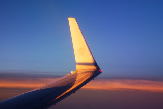 Boeing 737-700 — - Flying over the Gulf of México at dawn