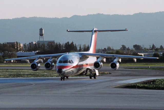 British Aerospace BAe-146-200 (N184US) - KSJC - Ex PSA BAe-146 originally N361PS, crossing 30R for the Terminal C - Summer 1988br /br /E2044br /Aircraft Type British Aerospace 146-200Abr /First Flight 02. Oct 1985br /Age 30.8 Yearsbr /Airframe Status Stored