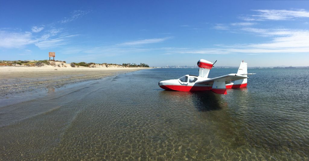 LAKE LA-200 (N7615L) - Lake Amphibian N7615L in south San Diego Bay at Silver Strand beach, Coronado, California.  The skyline of San Diego is visible in the distance.