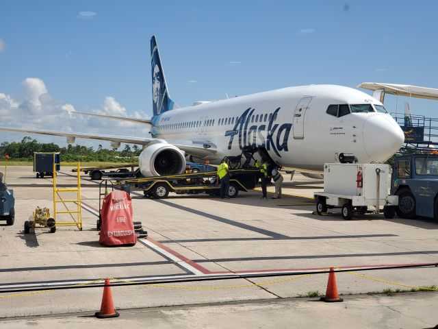 N517AS — - Waiting in the terminal in Belize City. Alaska airline loading wheelchair customers.