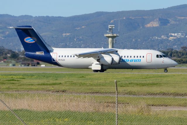 Avro RJ-100 Avroliner (VH-NJH) - On taxiway heading for take-off on runway 05. Tuesday 22nd July 2014.