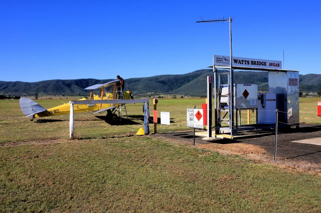 OGMA Tiger Moth (VH-BCC) - Owner topping up tank for an afternoon aerobatics at the very pretty Watts Bridge Queensland airstrip