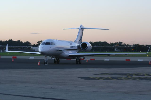 — — - Global Express early morning on the ramp in Syndey Australia.