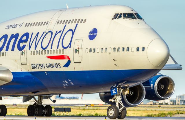 Boeing 747-400 (G-CIVZ) - Friendly waves from the BA flight crew as they wait their turn at runway 06L and departure to Heathrow