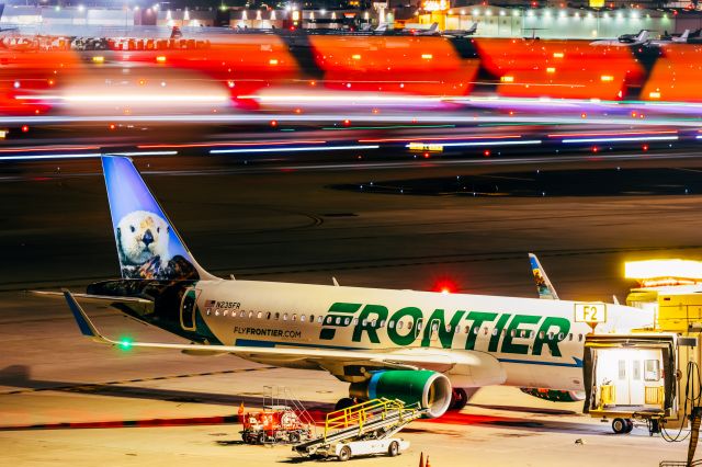 Airbus A320neo (N235FR) - Frontier Airlines A320neo "Pike the Otter" parked at PHX on 1/6/22. Taken with a Canon R7 and Tamron 70-200 G2 lens. 1 minute long exposure photo.