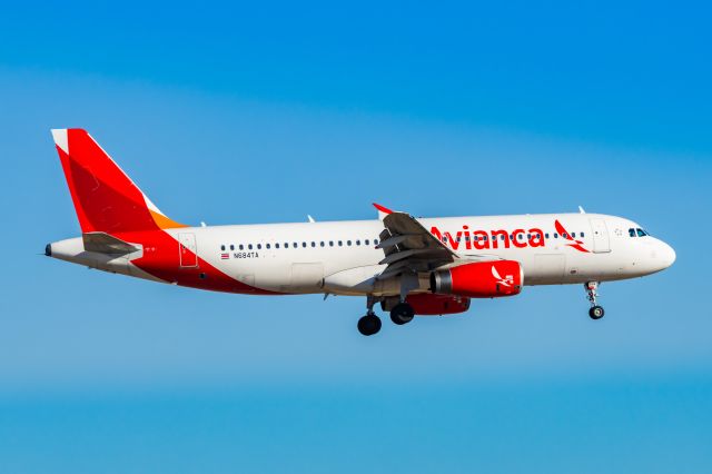 Airbus A320 (N684TA) - Avianca El Salvador A320 landing at DFW on 12/27/22. Taken with a Canon R7 and Tamron 70-200 G2 lens.