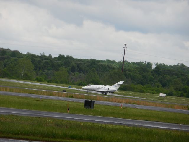 Boeing Goshawk (N599LP) - A Hawker Beechcraft Hawker 750 Taxiing To The Ramp Just After A Short But Heavy Rainstorm Hit, This Was Taken The Evening Before Manassas Airshow 2017, Which Was A DISASTOR for me! nothing flew and to make it WORSE it was cold and i was still a little bit sick! but at least the evening was good, AND NOT SUPER WET!