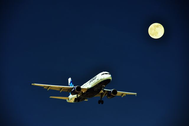 Airbus A320 (UNKNOWN) - Jet Blue A320 landing at McCarran (KLAS) beneath a full moon