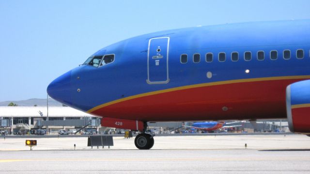 Boeing 737-700 (N428WN) - Holding short of RWY 19R