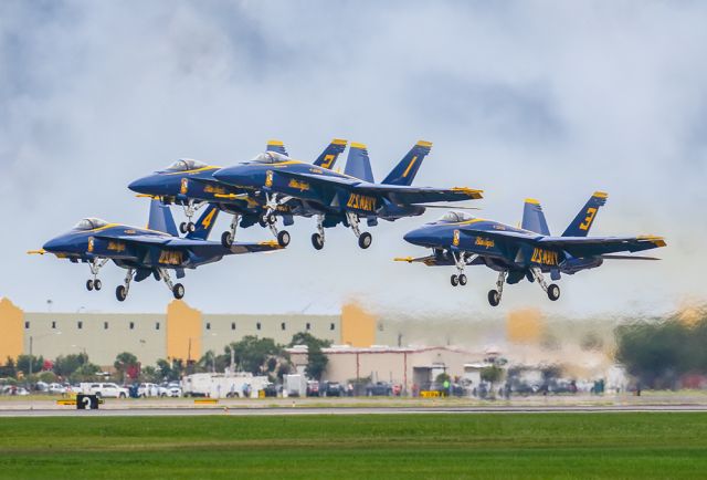 McDonnell Douglas FA-18 Hornet — - I love this photo of the four Primary Blue Angels just starting their show by doing a tight formation takeoff. I took the photo at the 2021 Sun N Fun expo at the Lakeland Florida airport. This was the debut show of the Blue Angels flying their new F18 Super Hornets. It's always a thrill to shoot this amazing performing group of aircraft and pilots. I shot this with a Canon 100-400 IS II lens at the focal length of 248mm. The camera settings were 1/5300 shutter speed, F/5, ISO 500. Please check out my other photography. Positive votes and comments are always appreciated...!!! Questions about this photo can be sent to Info@FlewShots.com