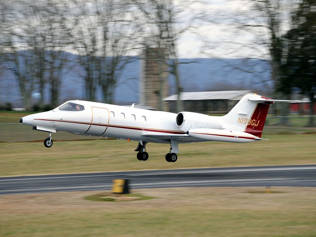 Learjet 35 (N198GJ) - I still have a hard time believing the Learjet 35 is a good cargo carrier as the door isnt quite wide enough to accomodate a pallet.  This gorgeous bird belongs to Royal Air Express, and is seen blasting out on its way back to home base in KPTK.