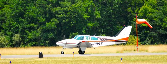 Beechcraft Baron (58) (N129ST) - As seen on takeoff roll just before rotate speed leaving M34.