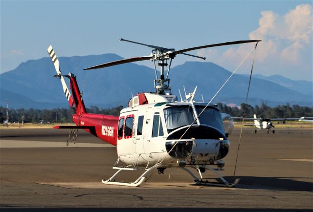 N216GH — - KRDD Aug 2019 Bell 206 on the ramp at Redding - those billowing thunderclouds behind and to the right, are actually in Oregon - but the whole north state is always on alert with extra aircraft and helicopters on contract during the hot summer months in the Redding,CA area.