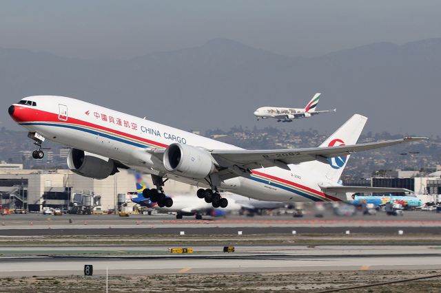 BOEING 777-200LR (B-2082) - Takes off from LAX with Emirates Airbus A380 landing in the background. 