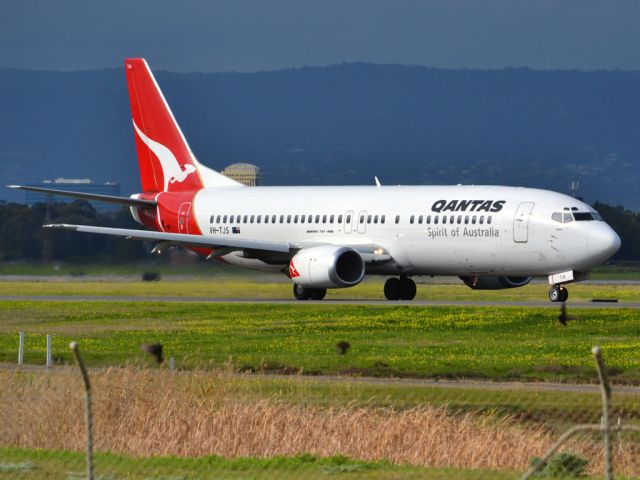 BOEING 737-400 (VH-TJS) - On taxi-way heading for take off on runway 05. Thursday 12th July 2012.