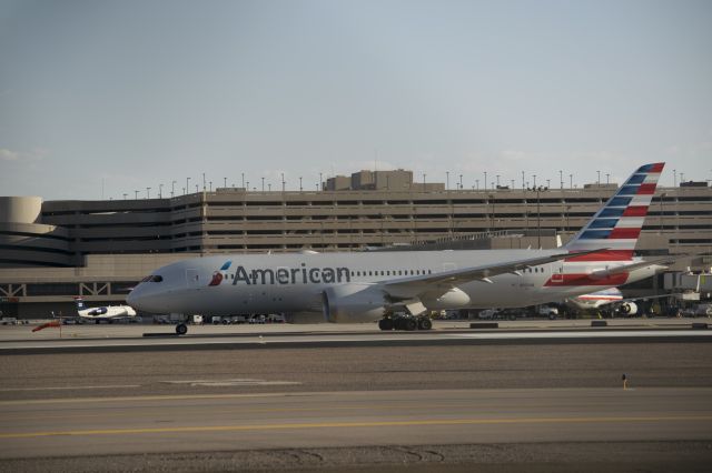 Boeing 787-8 (N800AN) - Taken through a fence. End of rwy 26 waiting for gate.