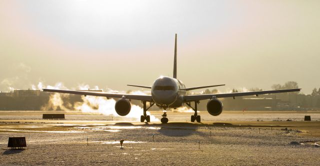 Boeing 757-200 (N930FD) - Fed Exs "Diana" (N930FD) is silhouetted by the bright early morning sun directly behind and above it as it makes a U-turn on the runway 16R overrun in order to line up for takeoff on 16R.