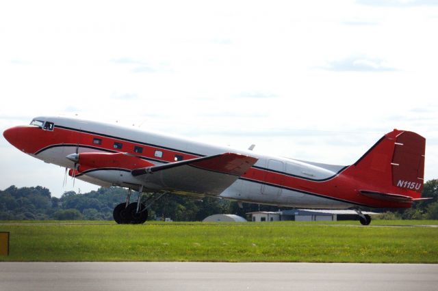 Douglas DC-3 (turbine) (N115U) - DC3 arrival to Beverly Regional Airport on 8/1/21. 