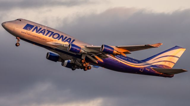 Boeing 747-400 (N919CA) - N919CA Getting airborne as the sun sets from Perth bound for Hong Kong after dropping a load of Fire Retardant off. 