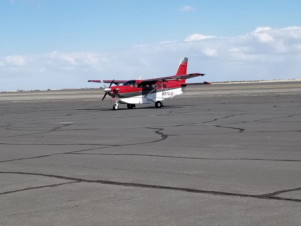 Quest Kodiak (N974JB) - Standing in the parking lot at Ephrata Municipal Airport. 