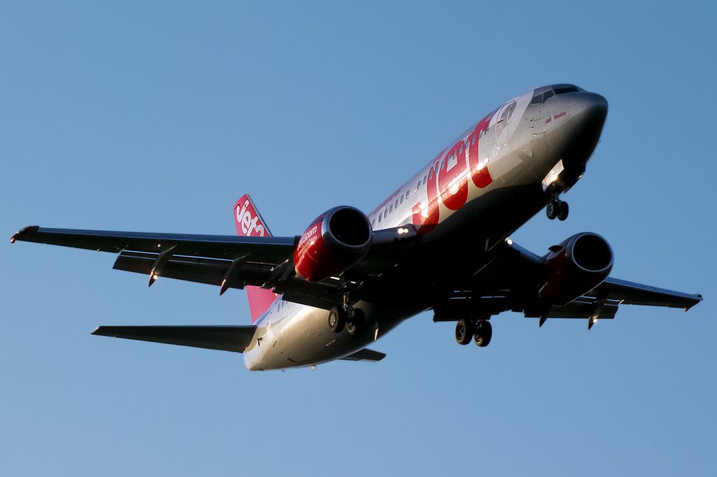 Boeing 737-700 (G-CELC) - In sunset light.