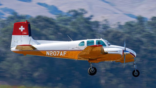 Beechcraft Twin Bonanza (N207AF) - Beech C-50 Beechcraft Twin Bonanza arrives at Santa Maria Public Airport.