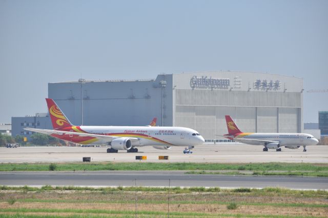 Boeing 787-8 (B-7667) - Big brother B787-8 and his little brother Captial A320 is waiting