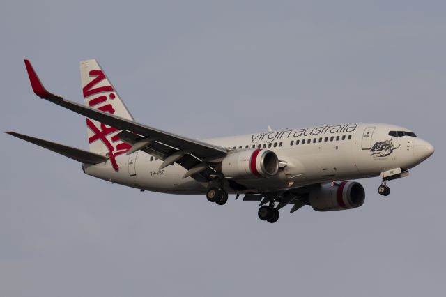 Boeing 737-700 (VH-VBZ) - One of two Virgin Australia Boeing 737-700 on short finals to runway 05 from Brisbane.