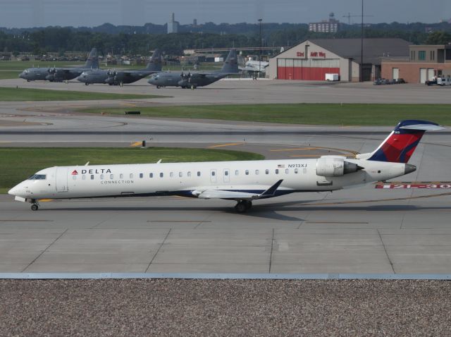 Canadair Regional Jet CRJ-900 (N913XJ) - Taxiing next to 30R at MSP on 07/31/2011