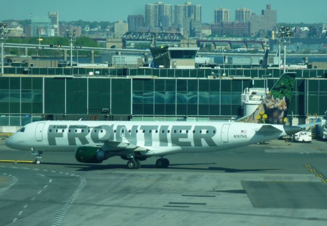 Embraer ERJ-190 (N167HQ) - Frontier (operated by Republic) E-190 N167HQ pushes back from Overnight parking at KLGA on May 8,2011. Originally N960UW with USAirways, was recently repainted from the Midwest scheme with "Mo and Jo" the red fox cubs previously on the tail of A318 N804FR.