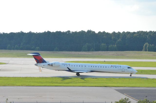 Canadair Regional Jet CRJ-900 (N305PQ) - Delta (Endeavor Air) 3504 departing for New York JFK at 6:49 PM EDT.   Photo taken June 30, 2016 with a Nikon D3200 mounting 55-200mm VR2 lens set at F16 aperture.