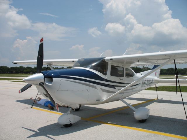 Cessna Skylane (N570DB) - A small child catching some shade under the wing! Haha..