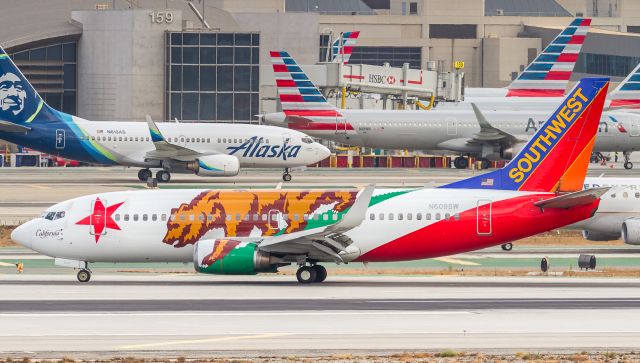 Boeing 737-700 (N609SW) - California One waits for clearance to cross the active and head to the gate