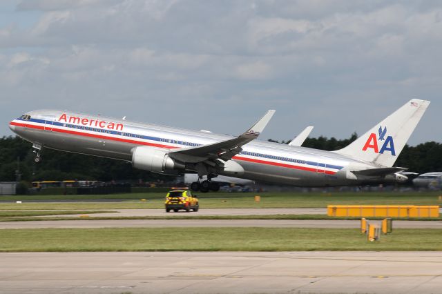 BOEING 767-300 (N396AN) - American leaving Manchester- note the seemingly small car in the foreground