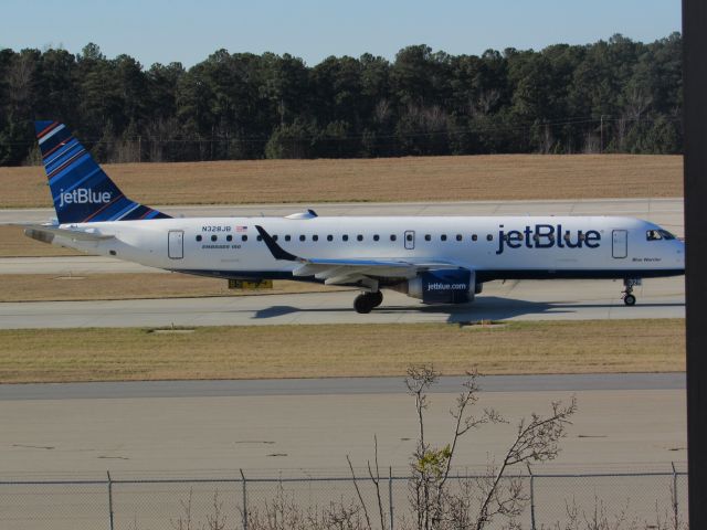 Embraer ERJ-190 (N328JB) - JetBlue flight 1084 to Logan Intl, an Embraer 190 taxiing to takeoff on runway 23R. This was taken January 30, 2016 at 3:30 PM.