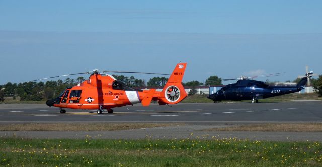 N6511 — - Sharing the tarmac is this USCG Aerospatiale MH-65E Dolphin and N189J, a 2001 Sikorsky S-65C Rotorcraft in the Autumn of 2023.