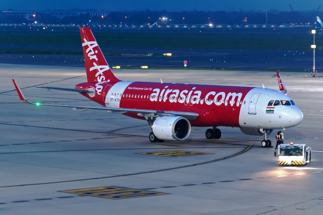 Airbus A320 (VT-ATD) - Red Knight ready for departure on a monsoon evening at IGIA T-3 as I5-857 bound for Bengaluru.  This aircraft was newly delivered to AirAsia India on 20 Oct 2020 as AirAsia India’s first Neo.