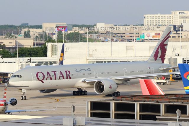 BOEING 777-300 (A7-BEN) - Qatar Airways (QR) A7-BEN B777-300ER (cn64064]br /Chicago O’Hare (ORD). Navigating the crowded O’Hare apron heading to a departure gate for the evening Qatar Airways flight QR726 departure to Doha Hamad International (DOH)br /br /Taken from roof level (6th Floor) parking garage A.br /2018 06 07br /a rel=nofollow href=http://alphayankee.smugmug.com/Airlines-and-Airliners-Portfolio/Airlines/Asia-Pacific-Airlines/Qatar-Airways-QR/https://alphayankee.smugmug.com/Airlines-and-Airliners-Portfolio/Airlines/Asia-Pacific-Airlines/Qatar-Airways-QR//a