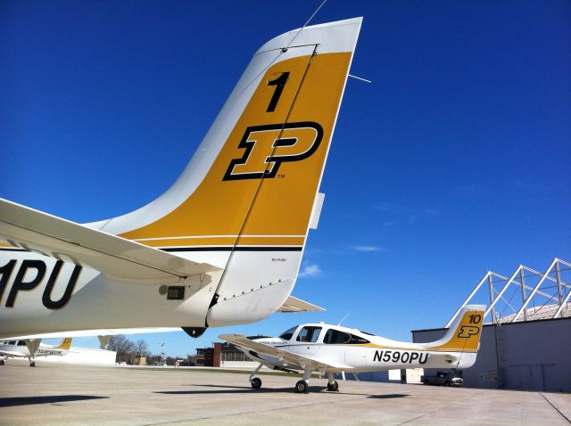 Cirrus SR-20 (N590PU) - Two of Purdues Cirrus SR20s resting between flight slots.