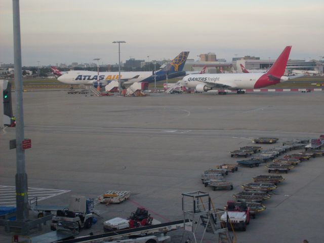 Boeing 747-400 — - An Atlas 747-400F operating into Sydney for Qantas passes a Qantas Freight 767-300F