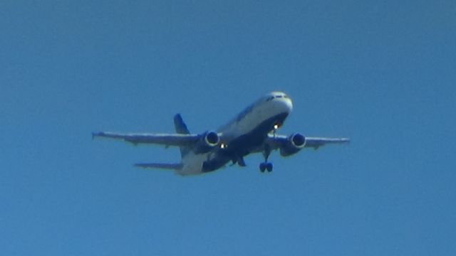 Airbus A320 (N589JB) - On approach for Long Beach. Note the gears extending while on short final.