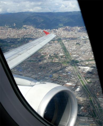 Airbus A320 (N691AV) - Bogota city seen enroute to MPTO.