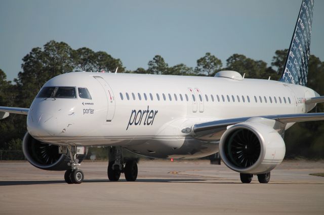 EMBRAER ERJ-190-400 (C-GKXT) - Porter Flight 535 taxis to gate at Southwest Florida International Airport following flight from Toronto-Pearson International Airport (12/9/24)