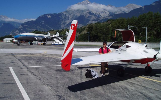 VELOCITY Velocity (HB-YHV) - My Velocity HB YHV parked in Sion, Switzerland, in front of a stillflying Super Constellation