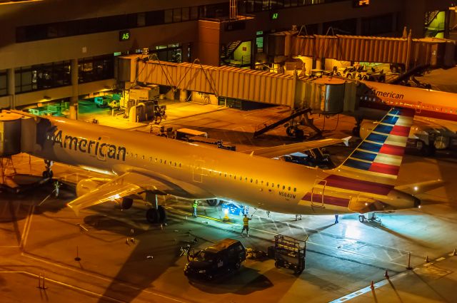 Airbus A321 (N584UW) - Midnight Lights| Arizonabr /br /This is what 11:30pm looks like on a Friday night at an airport. Cleaning crews make entry by van, under cover of darkness and furiously clean a very large aircraft with very small brushes. Lights, lifts, and long poles are their weapons of choice. br /br /Thanks for looking! Please vote if you like my work!br /br /©Bo Ryan Photography | a rel=nofollow href=http://www.facebook.com/boryanphotowww.facebook.com/boryanphoto/a