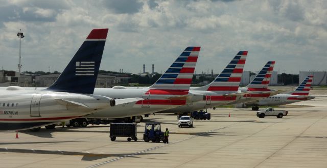 Airbus A321 (N578UW) - US Airways Heritage Livery in front at the AAL Departure Terminal.  Summer 2022.