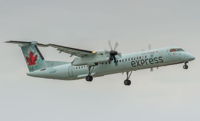 de Havilland Dash 8-400 (C-GGOF) - Grey day spotting in Toronto as this Jazz Dash 8 makes her way down to runway 23 at YYZ
