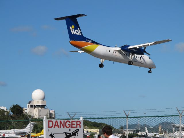 de Havilland Dash 8-300 (V2-LES) - Dash 8 shortly before touchdown on Rwy 10 - February 2010