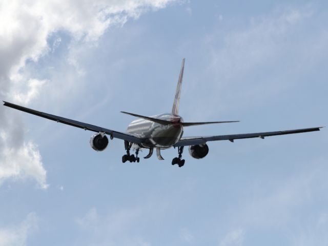 Boeing 777-200 — - The last shot in the missed approach sequence the B777-200ER is a few thousand feet above aerodrome level heading further skyward, like a rocket!