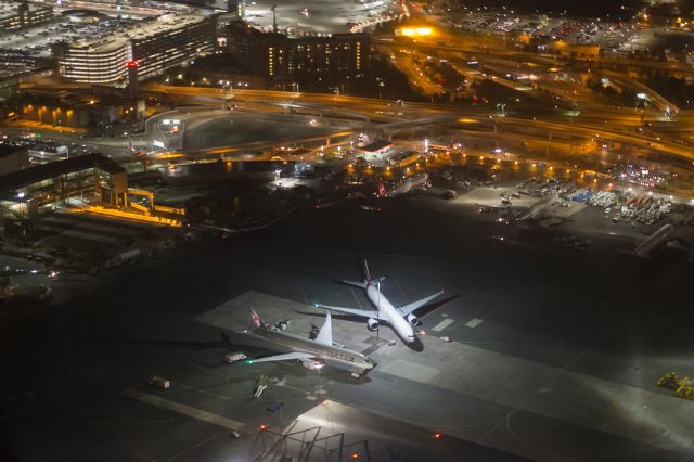 — — - QR, EK, and TK are waiting for their evening departures. You can also see the new terminal E gates coming along for the A380.